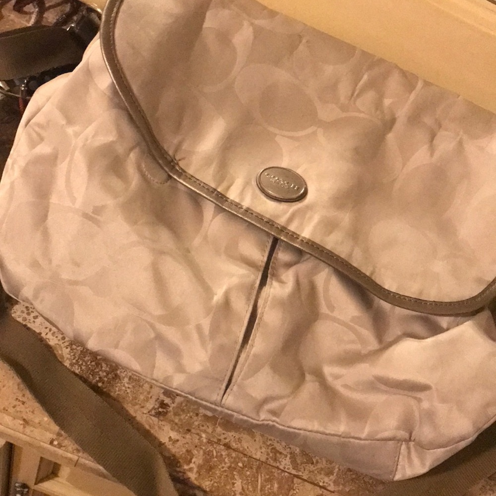 Tan and gold coach bag